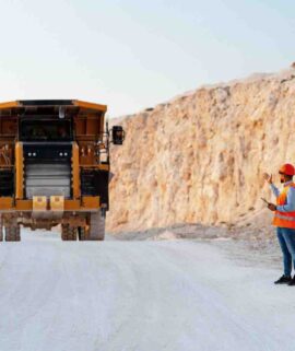 mining-engineer-directing-dumper-truck-in-open-pit-2026-01-07-06-34-05-utc