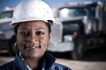 portrait-of-female-worker-in-hard-hat-in-front-of-2026-01-09-09-28-23-utc