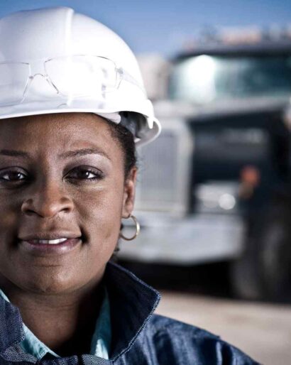 portrait-of-female-worker-in-hard-hat-in-front-of-2026-01-09-09-28-23-utc